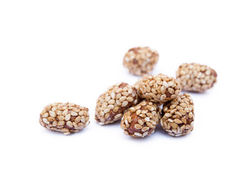 Coated peanuts with sesame isolated on white background