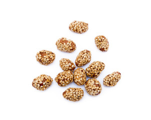 Coated peanuts with sesame isolated on white background