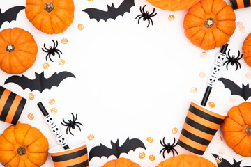 Halloween party background with pumpkins, spooky bats, creepy spiders