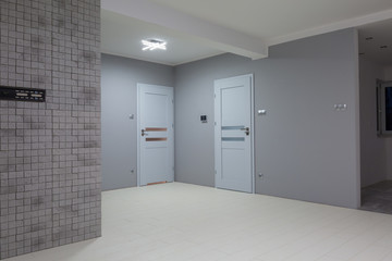 Renovated gray living room with new laminated floor