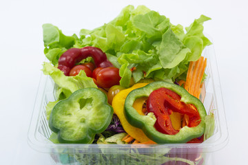Close up A green salad is a dish consisting of a mixture of small usually vegetables 