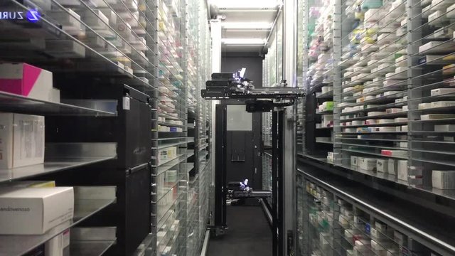 12 09 2018 Modena - future technology automatic pharmacy warehouse automatic robot. no umans interactions. Pharmaceutical Robot Dispenser for pharmacy