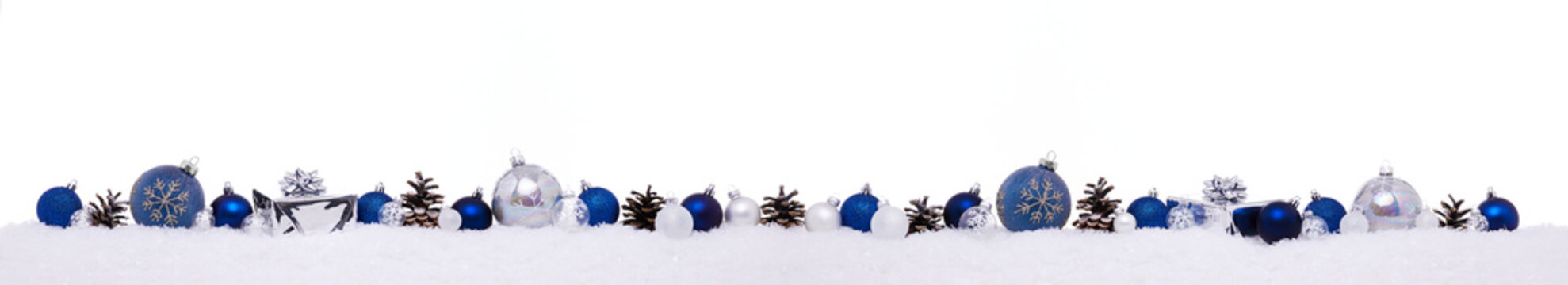 Blue christmas balls with xmas present gift boxes in a row isolated on snow, Christmas banner