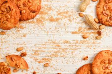 Peanut cookies on wooden table with sugar.