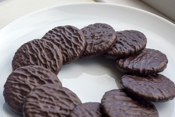 Dark chocolate and ginger biscuits on a plate