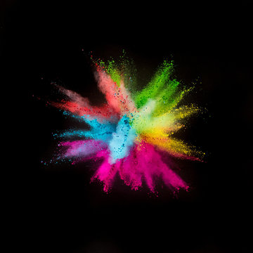 Colored powder explosion on black background.