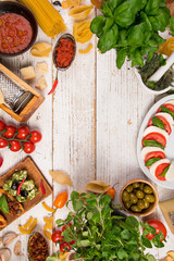 Italian food ingredients on old wooden background