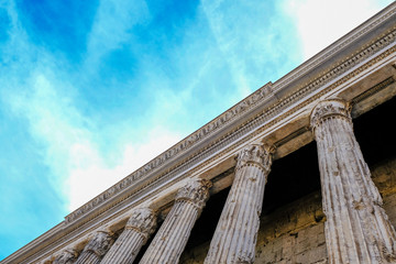 View of Colonnade of the Pantheon against the blue sky. Ruins of Ancient Rome.