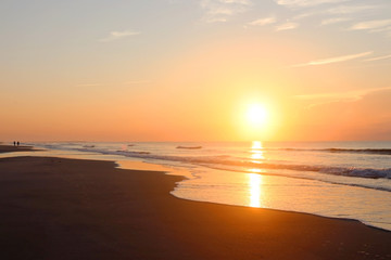 Fototapeta na wymiar Beautiful sunrise over the ocean nature background.Southern marine landscape with sun rising over the atlantic ocean at the Huntington Beach State Park, Litchfield, Myrtle Beach area, South Carolina.