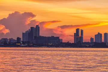 Beautiful sunset and modern city with sea font ,Pattaya,Thailand