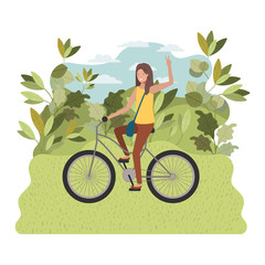 young woman in bicycle on the park