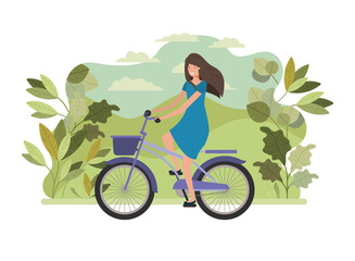 young woman in bicycle on the park