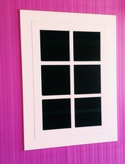 White window on pink wall