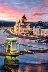 Aerial view of the Parliament building at sunset in Budapest, Hungary. Green light on the Chain...