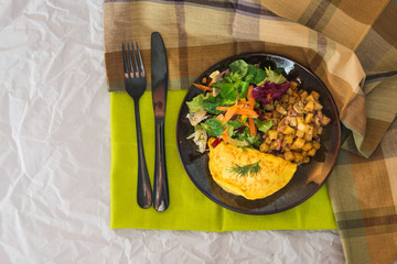 French Omelette with Potatoes, Mushroom and Salad