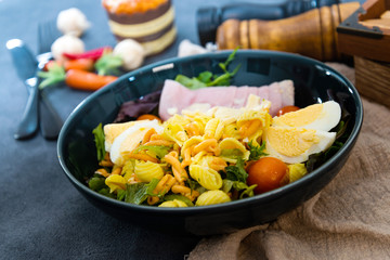 Fresh fruits salad and ham with egg