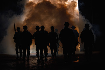Fototapeta premium soldiers walkers carry weapon of fire