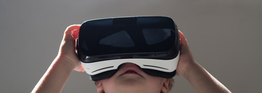 Future is now. Small child wear wireless VR glasses. Little child in VR headset. Adorable kid use modern technology. Digital future and innovation. New technology. Its so real