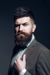 Your barber always knows everything that goes on. Business as usual. Bearded man after barber shop. Man with long beard in business wear. Mens fashion. Fashion is a completely international business