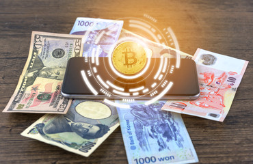 Businessman Shake hands on bitcoins and Banknotes dollars, money, won, yen. the form of digital (Cryptocurrency) an intermediary in the exchange of goods and services. Image use for business concept.