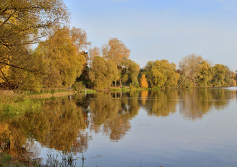 autumn landscape by the lake in the period of golden autumn
