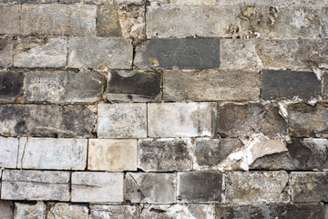 The texture of the old wall of stone blocks