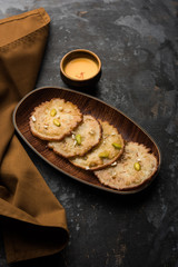 Malpua sweet - Traditional Indian dessert or pancake for festivals, served in plate with rabri/rabdi . selective focus