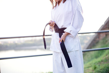 Karate black belt on white kimono.