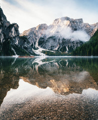 View of Braies Lake with reflection in Dolomites mountains in the morning, Pragser Wildsee, South...