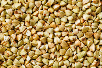 raw green buckwheat background, organic vegan food. Texture