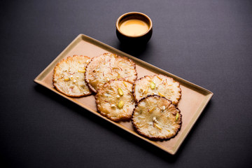 Malpua sweet - Traditional Indian dessert or pancake for festivals, served in plate with rabri/rabdi . selective focus
