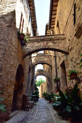 Floral streets of Spello in Umbria, Italy. - obrazy, fototapety, plakaty