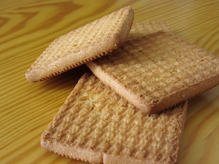 Close up of cookies on wooden table . Four biscuits for breakfast