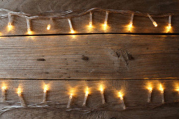 Christmas rustic background - old wood with lights and free text
