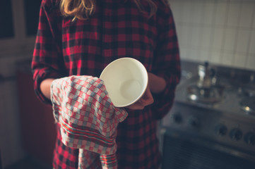 Young woman doing the dishes