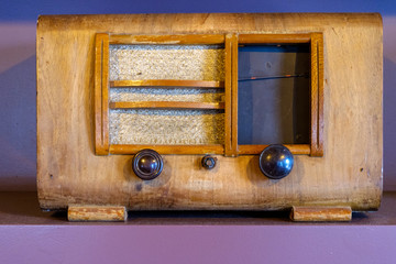 Old retro radio receiver on shelf