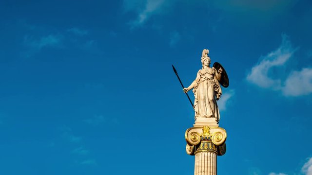 Statue of Greek goddess Athena on a Column, Athens, Greece. White clouds move fast across the blue sky. Time lapse video.