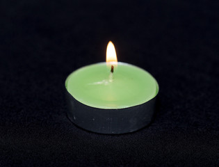 Obraz na płótnie Canvas Group of burning candles on black background