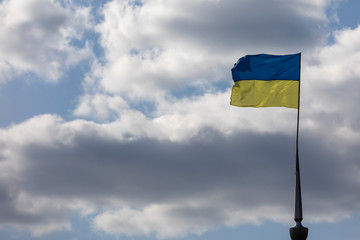 Ukrainian flag on a cloudy sky