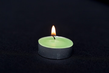 Obraz na płótnie Canvas Group of burning candles on black background