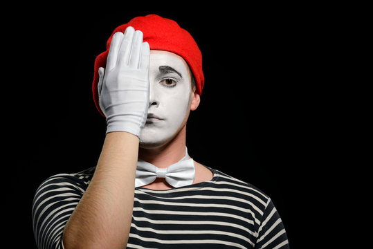 Mime covering half of face
