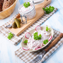 delicious homemade meat salad with mayonnaise and cucumber