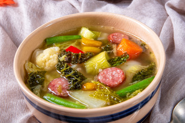 delicious autumnal vegetable soup with sausage and bacon