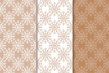 Snowflakes. Seamless patterns. Set of beige winter ornaments