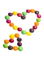 Fototapeta na wymiar Heart Made of Colorful Chocolate Coated Candies
