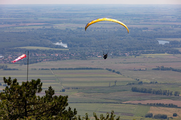 A person with a parachute over Tokaj