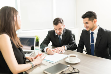 Businessman Accepting Proposal And Signing Contract