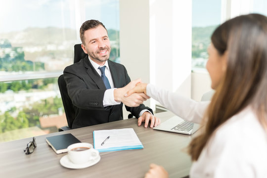 Recruiter Building Relationship With A Handshake During Interview