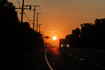 The sun rising over Pacific Coast Highway near Malibu.