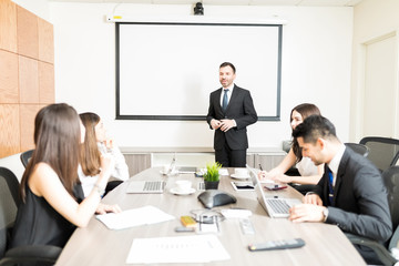 Business Partners Discussing In Meeting